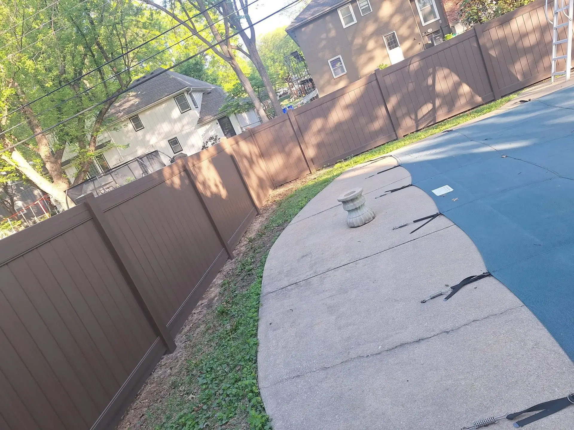 Brown vinyl pool fence Kansas City by Pride Fence KC