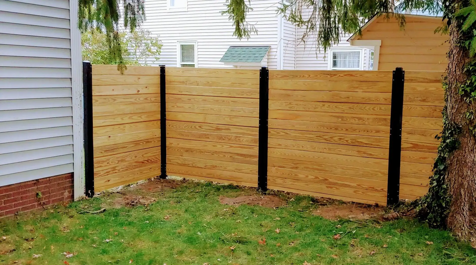 Horizontal wood fence with black steel posts Kansas City