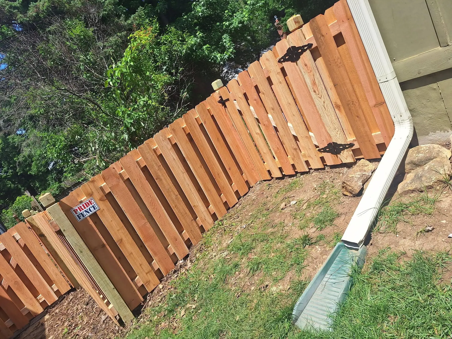 Short red cedar shadow box fence with gate Kansas City by Pride Fence KC