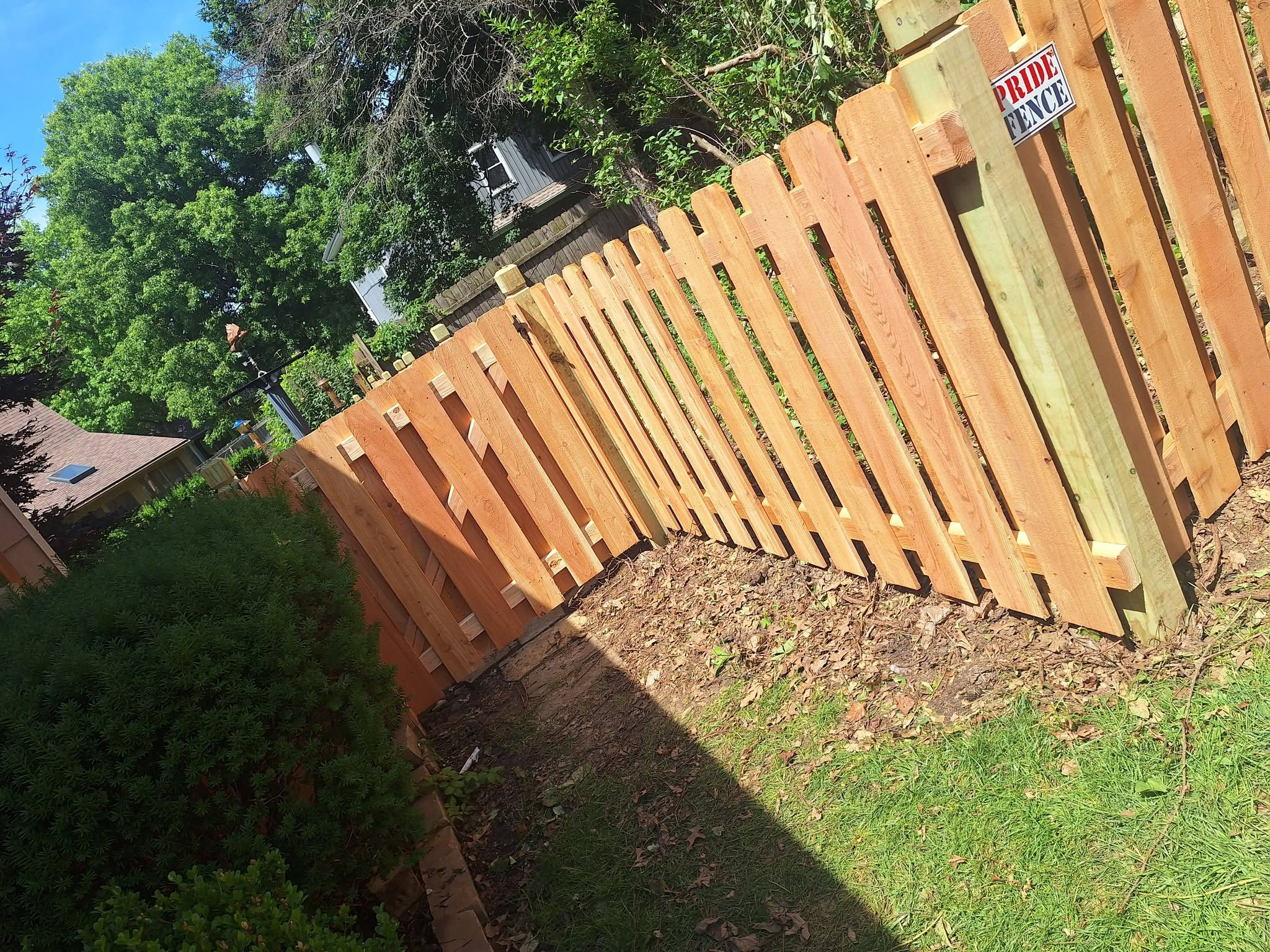 Short red cedar shadow box fence Kansas City by Pride Fence KC