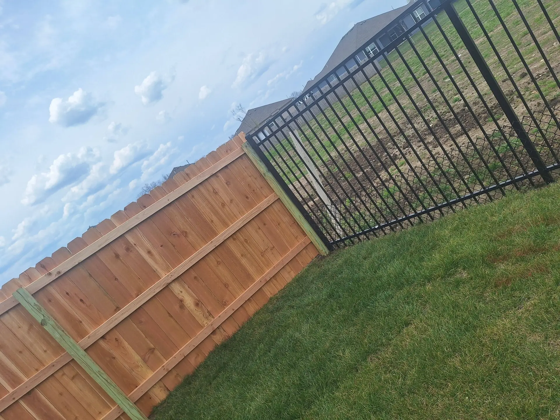 Steel and wood combination fence Kansas City by Pride Fence KC